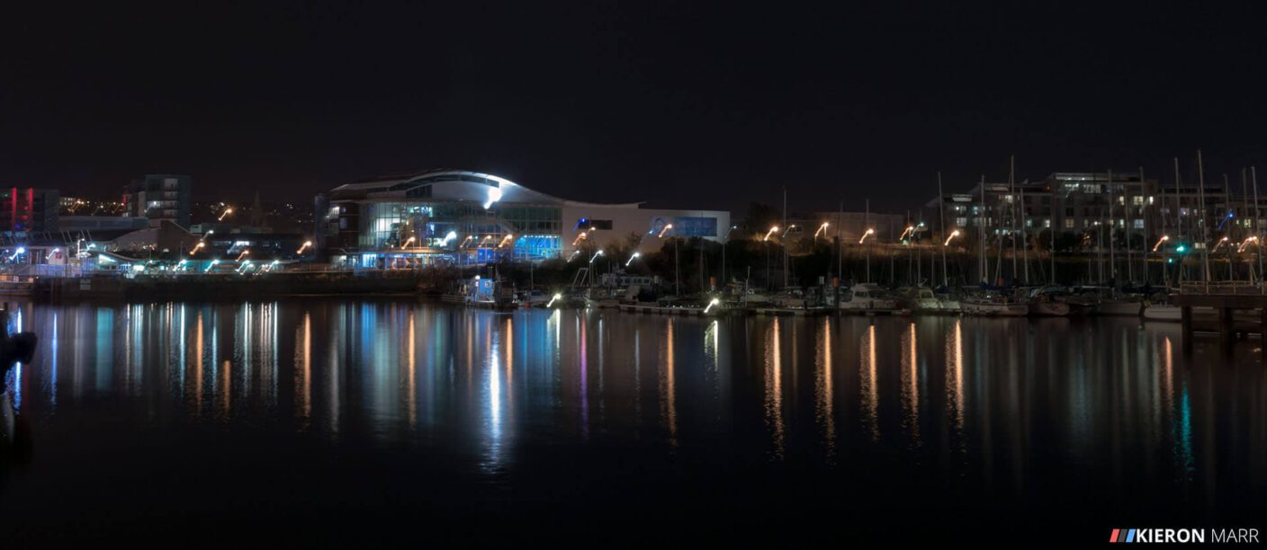 Plymouth Hoe at night with the lights reflecting off the water